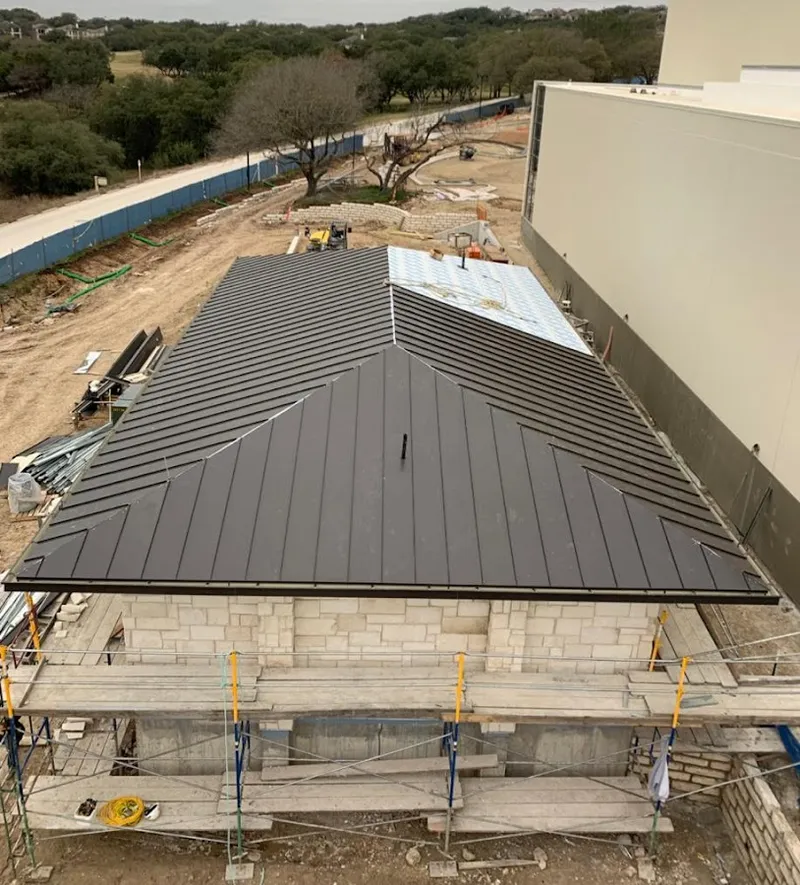Metal roof new construction with scaffolding in Rose Hill